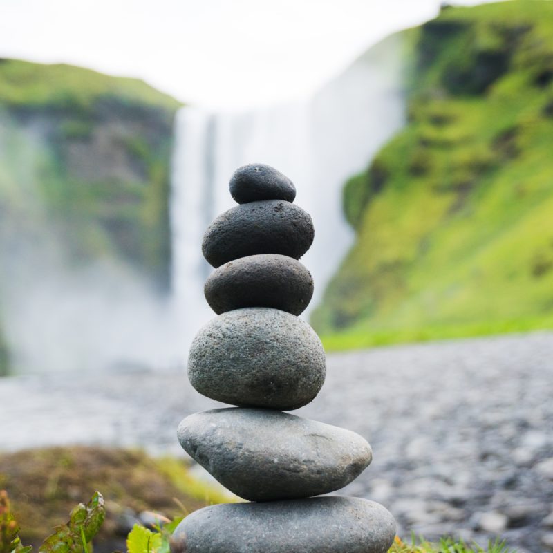 Stack of stones with a waterfall